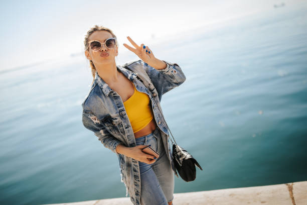 istock Pretty blond woman by the sea 1142565471
