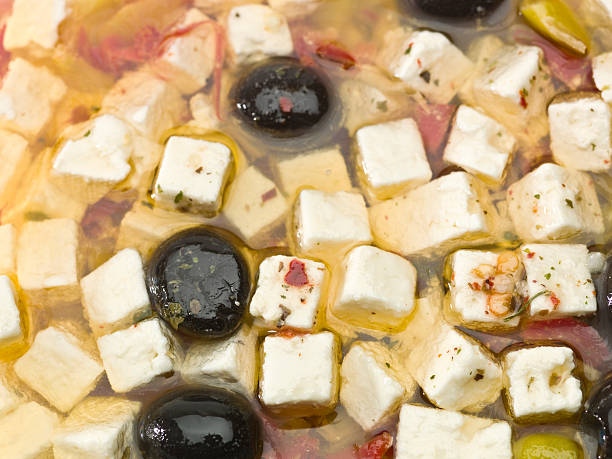 griego queso feta antipasto en aceite. - antipasto salad pepperoncini cheese fotografías e imágenes de stock