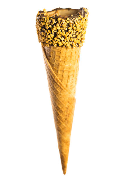 istock Empty crispy ice cream cone with border of chocolate and nuts isolated on white background 1142573989