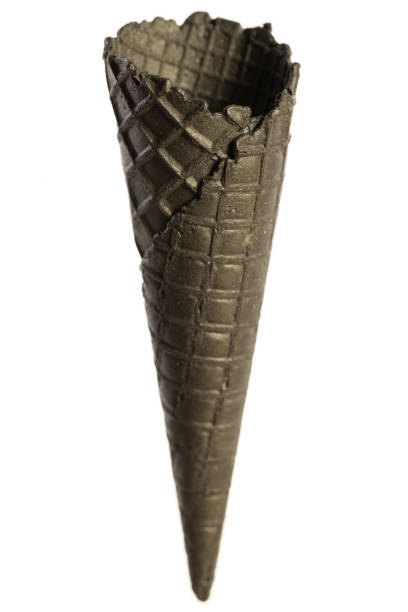 istock Empty, black, crunchy ice cream cone isolated on white background 1142574003