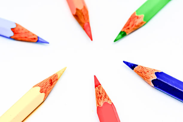 Wooden pencils of different colors on white background