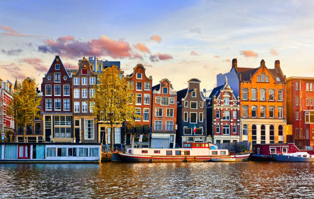 istock Amsterdam Netherlands dancing houses over river Amstel 1142582818