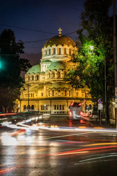 Alexander Nevsky Cathedral, downtown district in city of Sofia, capital of Bulgaria, Eastern Europe. Long exposure during night time with the evening illumination of the building and light trails from the passing traffic. Shot on Canon EOS R full frame system RF premium lens.