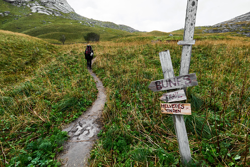 The trail leads through green hills up to bay of Bunes beach.