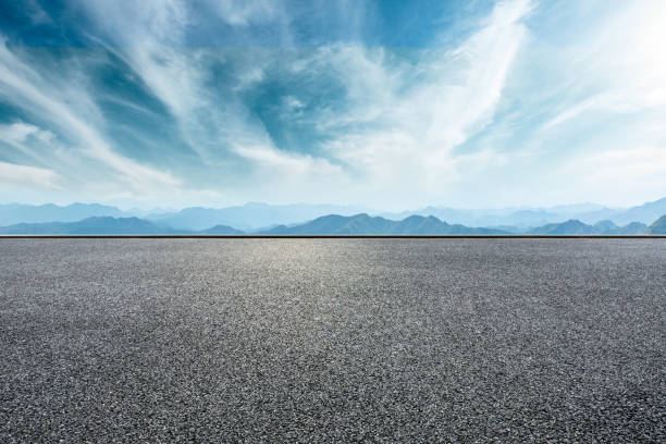 istock Asphalt road and mountains with beautiful clouds landscape 1142586698