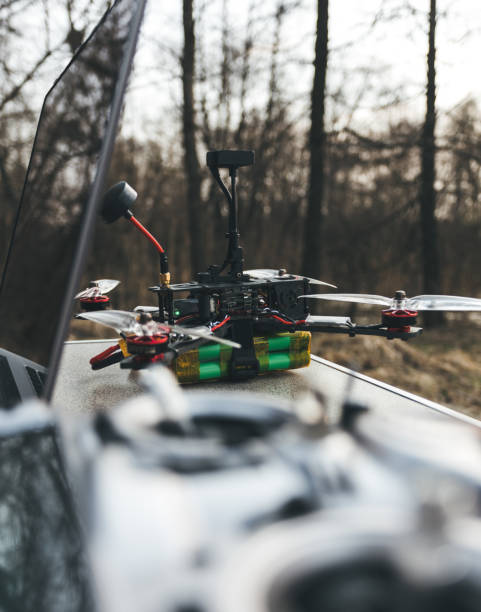 istock FPV drone lies on the table near the laptop and control panel. 1142588520