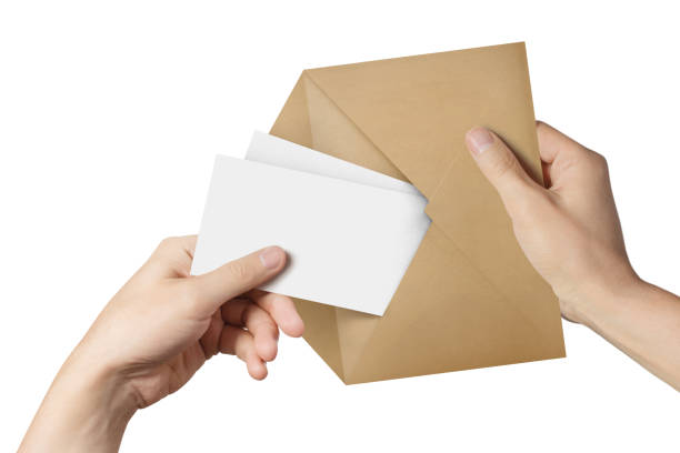 白い紙を2枚持っている手 - stationary sheet template paper ストックフォトと画像