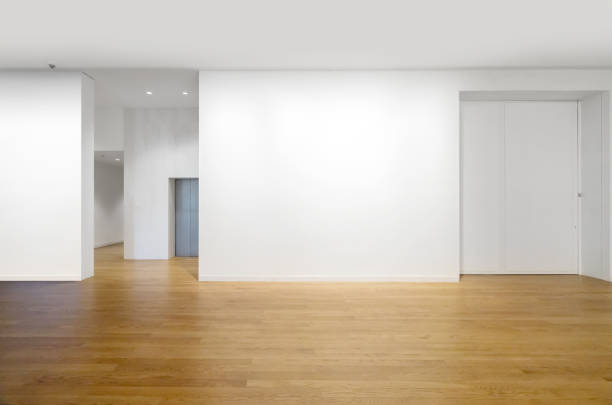 White walls and wooden floors in empty rooms