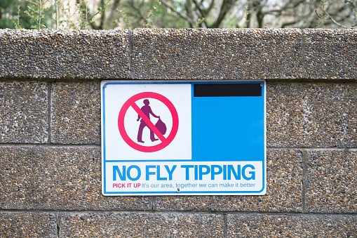 No fly tipping sign on wall  uk