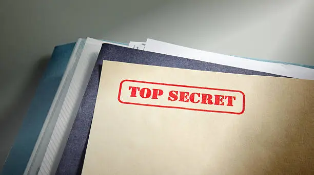 marked "top secret" on a pile of documents