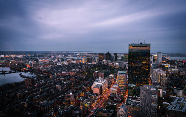 Aerial view of Boston at dusk Aerial view of Boston at dusk on a cloudy November day, with some skyscrapers and the Charles River to be recognized. east boston stock pictures, royalty-free photos & images