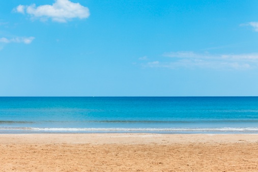 Perfect conditions with bright blue ocean and white sand beach on a sunny day. South Coast, NSW, Australia