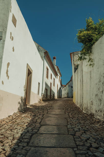 istock Charming facade of old houses with cracked plaster wall 1142597231