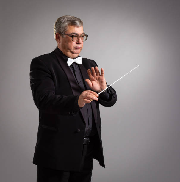 Adult conductor of the orchestra. stock photo
