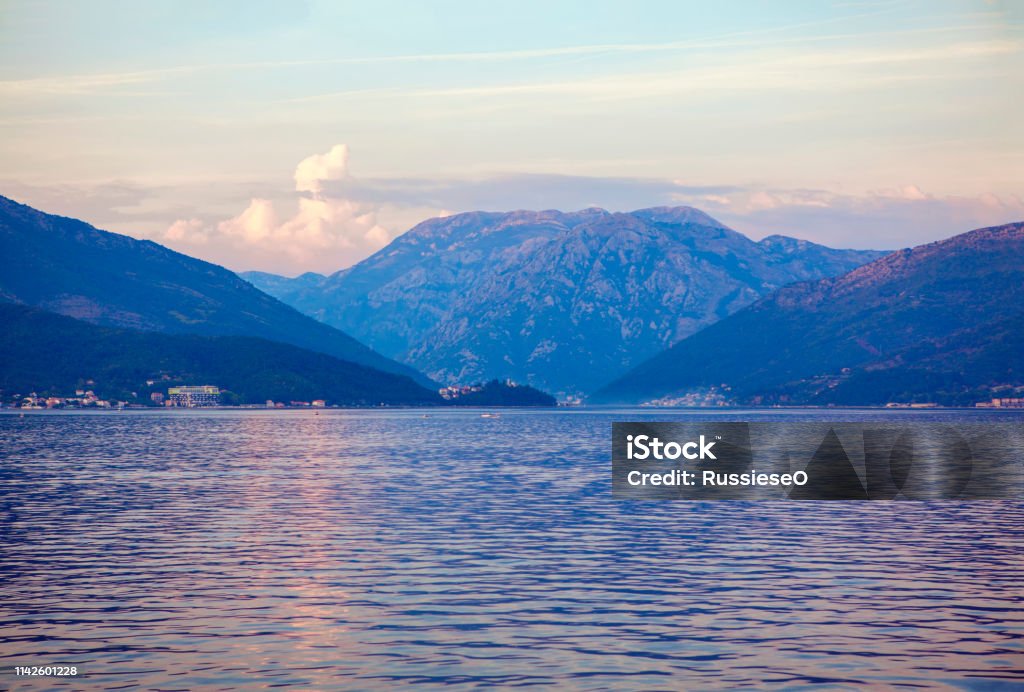 sea water surface and mountains landscape with sea and mountains in the evening Balkans Stock Photo