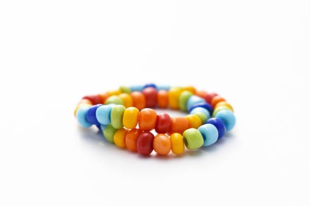 istock Glass Beads Bracelet Rainbow on White Background 1142601236