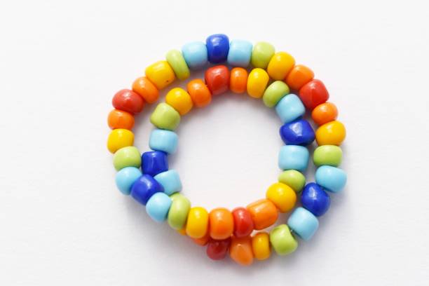 istock Glass Beads Bracelet Rainbow on White Background 1142601237