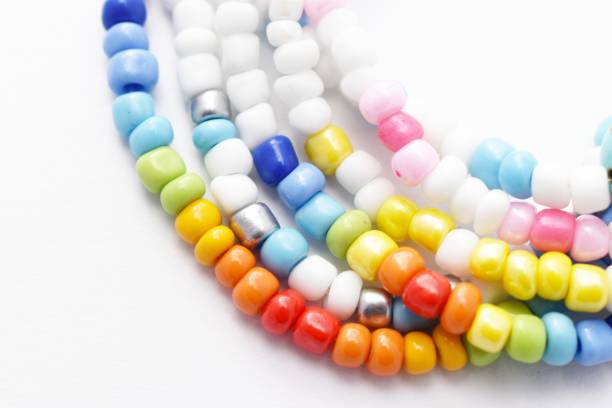 istock Glass Beads Bracelet Rainbow on White Background 1142601257