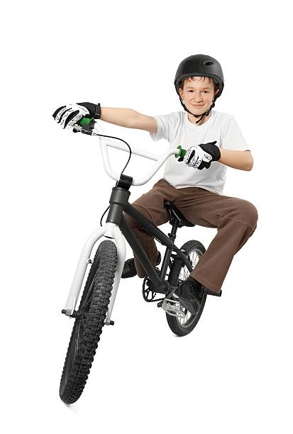 istock A boy riding a BMX bicycle on a white background 114260182