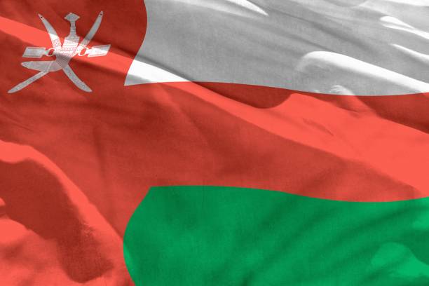 istock Waving Oman flag for using as texture or background, the flag is fluttering on the wind 1142605456