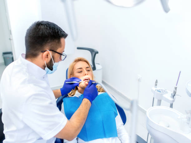 istock Dentists with a patient during a dental intervention 1142606865