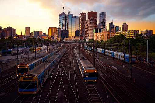 Melbourne train staation with Melbourne city background in sunset, Australia, this immage can use for Melbourne travel and transportation.