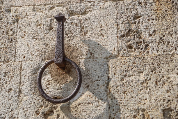 istock Metal door ring on the wall. Head Knocker. 1142608279