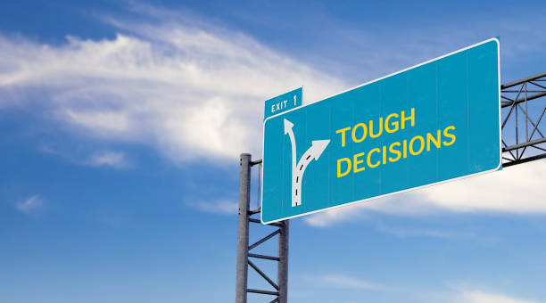 high way sign with motivation, warning or advice message about tough decisions - tough choices imagens e fotografias de stock