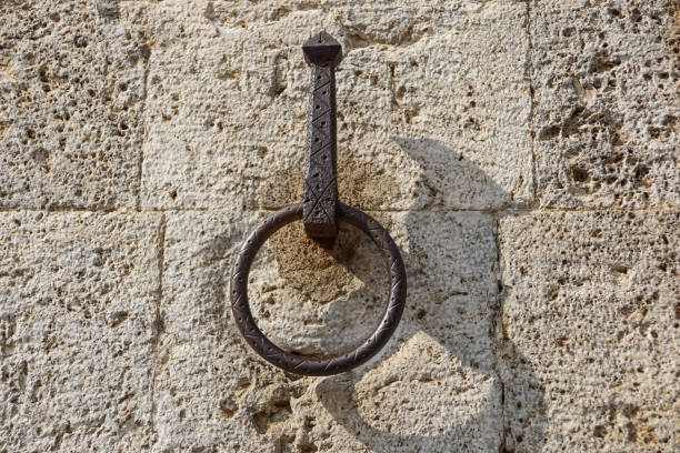 istock Metal door ring on the wall. Head Knocker. 1142610354
