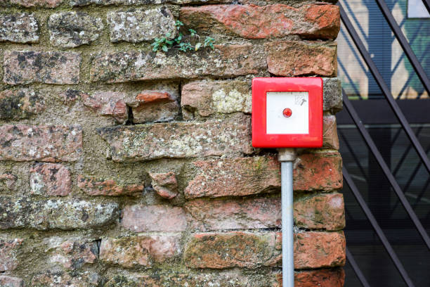 istock Fire alarm box on white cement wall for security warning alert, push button fire alarm in the building, isolated fire alarm botton box. 1142611796