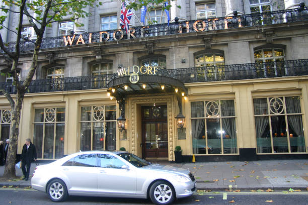 London, United Kingdom - June 22, 2018: St. James' Court Taj hotel resort entrance sign with Indian people tourists in city of Westminster