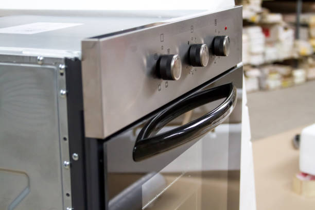 istock Close-up built-in electric oven in the store before installation. 1142613430