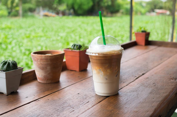 istock Iced coffee glass on wood table. 1142613721
