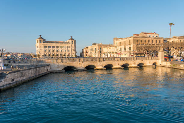 istock River, Bridge and Cityscape in Syracuse, Sicily, Italy 1142613823