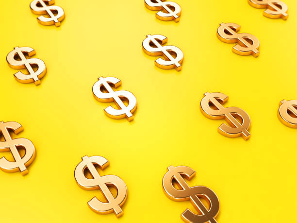 istock Golden Dollar Sign On Yellow Background Focused Image 1142614081