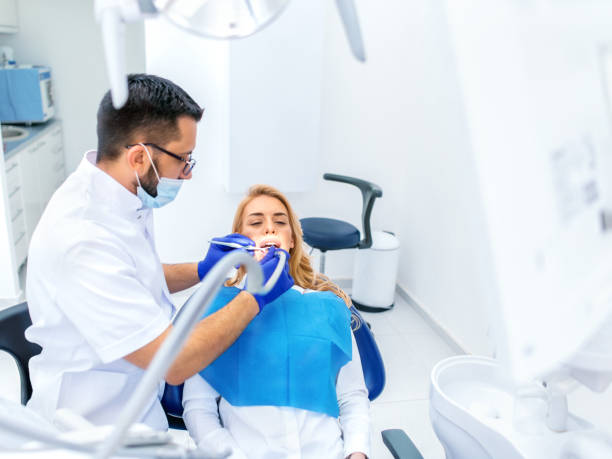 istock Dentists with a patient during a dental intervention 1142614146
