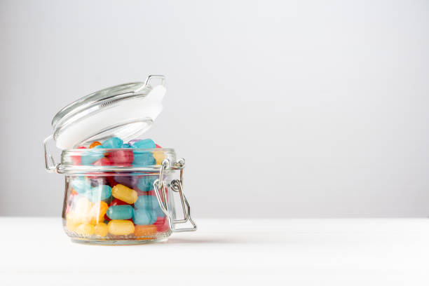 istock Multi-colored candies in a glass jar 1142615662