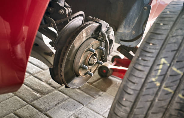 istock Replacing the wheels on a car on the service. 1142615664