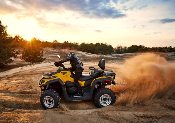 istock Racing in the sand on a four-wheel drive quad. 1142615795
