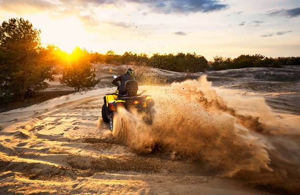 istock Racing in the sand on a four-wheel drive quad. 1142615799