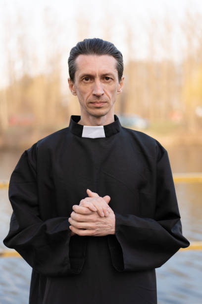 istock Portrait of handsome catholic priest or pastor with collar 1142616913