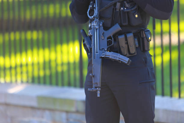istock Police Officer with Gun 1142618428