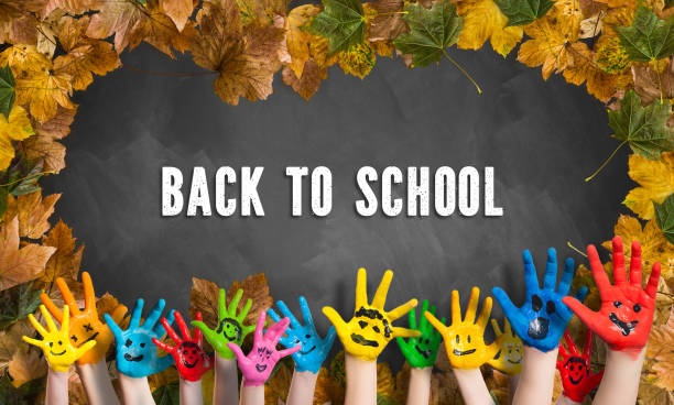 istock decorative leaves and a blackboard with many painted kid hands and the message 