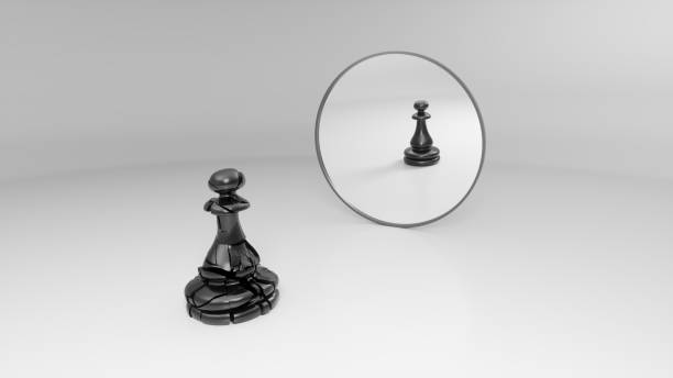 istock black pawn sees his broken reflection in the mirror 1142621196