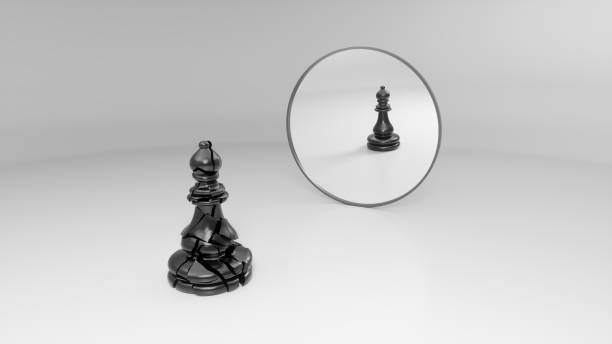 istock black broken bishop sees his whole reflection in the mirror 1142621246