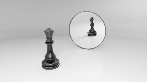 istock black queen sees his broken reflection in the mirror 1142621275