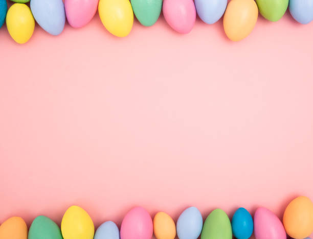 istock Easter border made with wooden colored eggs. View from the top. 1142621307