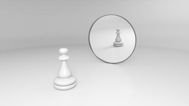 istock white pawn stands in front of the mirror 1142621368
