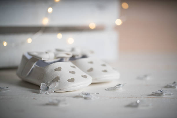 baby shoes on white vintage background