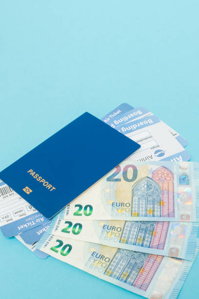 istock Tickets for plane and passport, euro on blue background. Copy space for text 1142622435